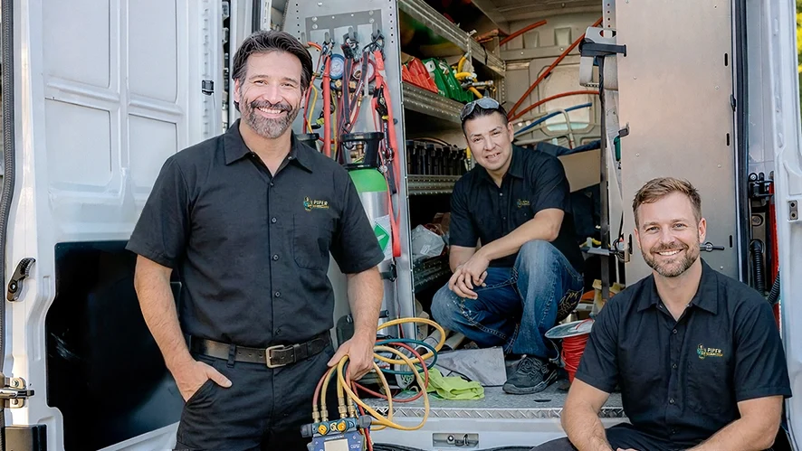 Experienced Alberta plumbing technician inside a plumbing supply warehouse